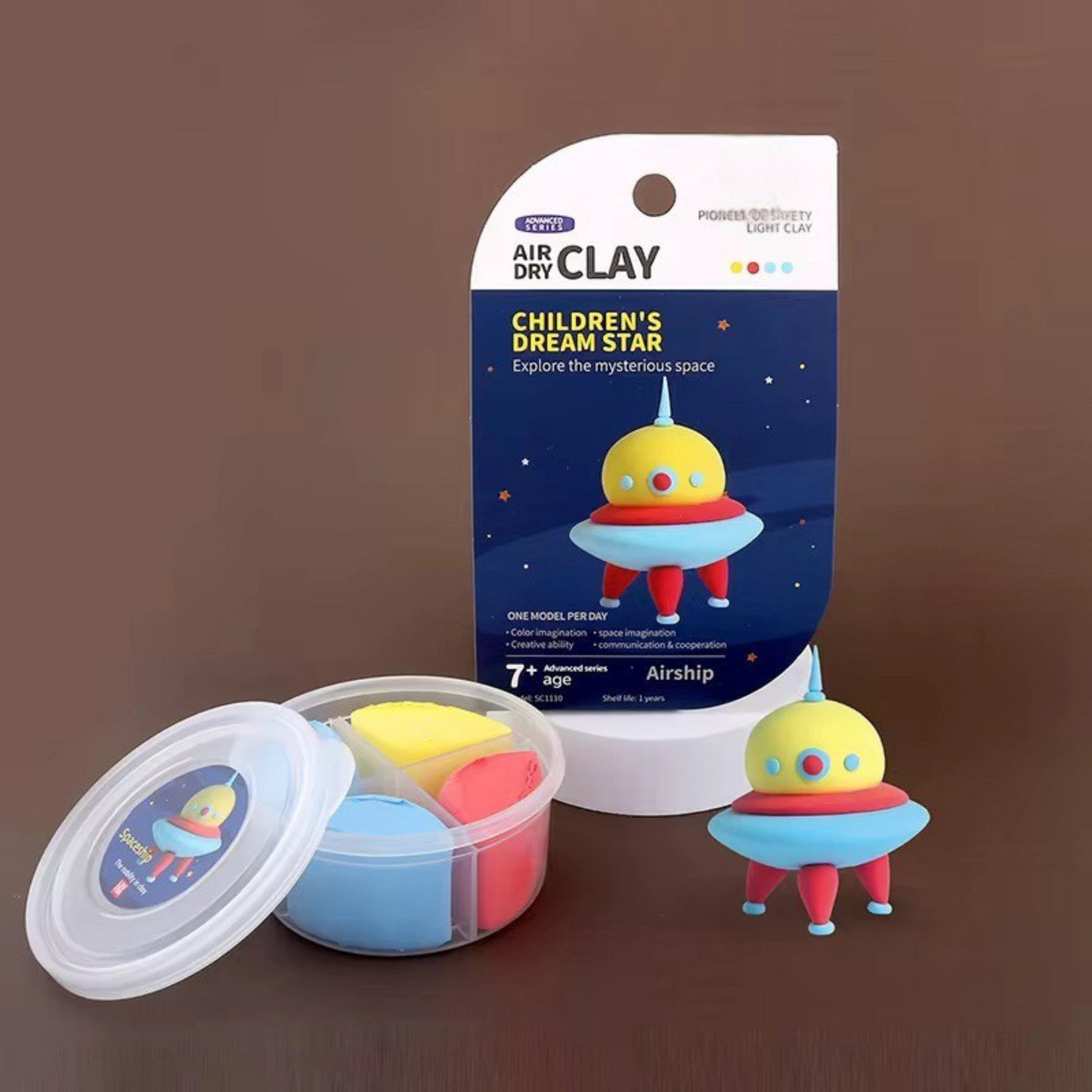 Handmade UFO figure next to a sealed air-dry clay container. High-quality non-toxic material, ideal for crafting detailed figures while strengthening kids’ fine motor skills and imagination.