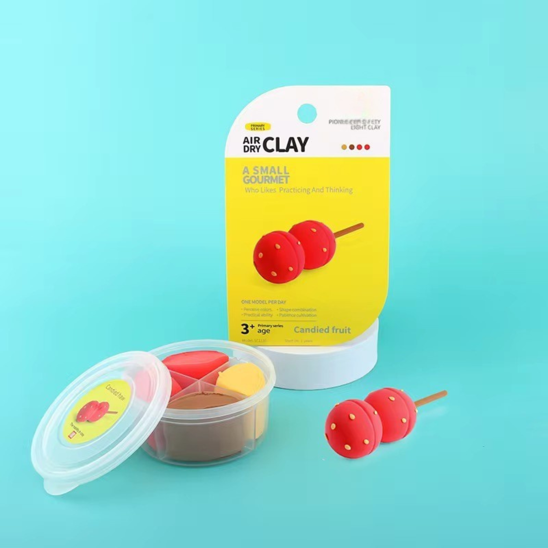 Single candied fruit clay figure made from bright red and yellow air dry clay. Beautifully packaged individual project perfect for gifting, party favors, or collector-style crafting. Encourages mindful play and creativity without screens.