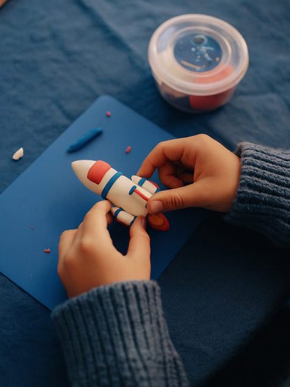 Space adventure clay kit gift box showing colorful figures and clay tubs, includes 12 creative projects, sculpting tools, and instructions, gift ready packaging designed for birthdays, Christmas, or holiday presents for kids ages 5 to 10.