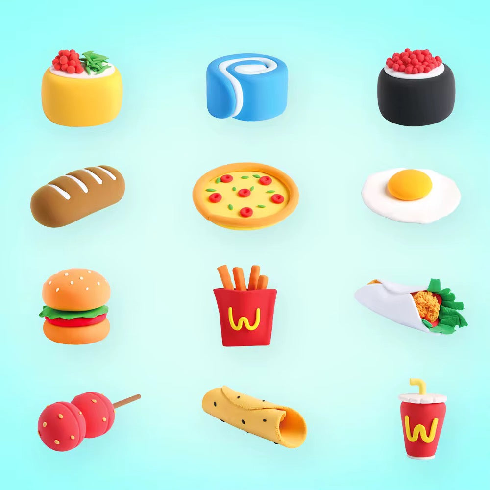 Flat lay of colorful fast food clay creations including pizza, fries, cola, wrap, and hamburger. Montessori-style air dry clay activity kit for kids age 3+, supporting creativity and hand-eye coordination. Makes a fun party activity or classroom project.