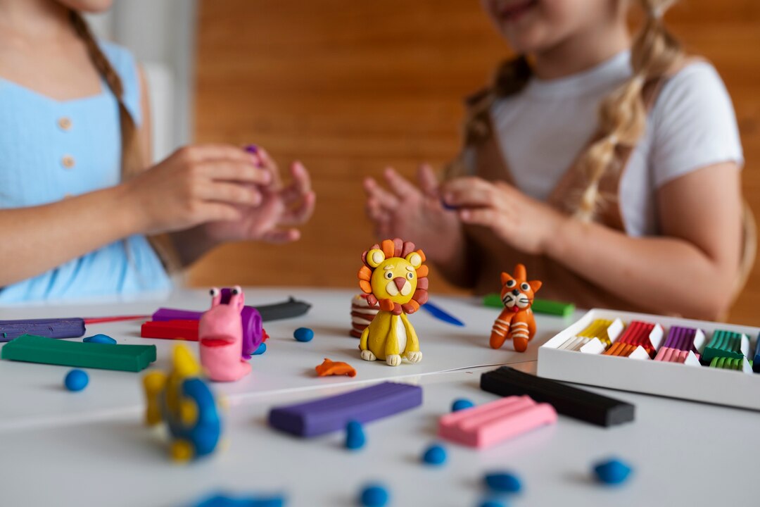 Two happy children crafting cute lion, fish, and unicorn figurines using OLIHUG air dry clay kits. Montessori-inspired creative play encourages self-expression, mindfulness, and joy through hands-on making. A cozy home scene that inspires parents and kids to create meaningful memories together.