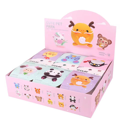 Open view of OLIHUG clay box with example panda craft card and full kit insert. Appeals to buyers looking for ready-made creative play in structured kits.